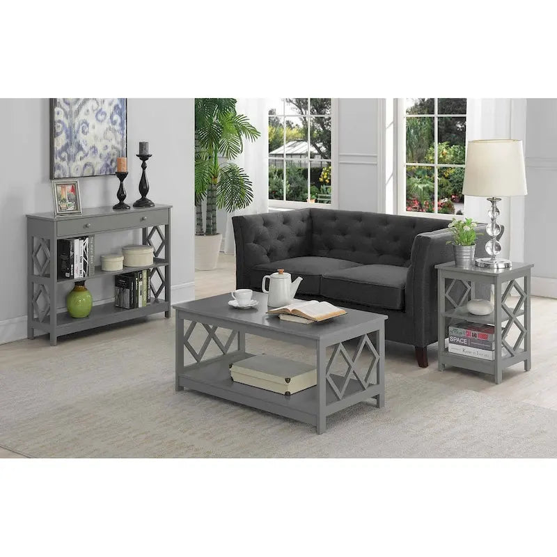 Table basse à deux niveaux avec découpes en losange, coloris noir/blanc/gris et étagère inférieure