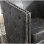 Fauteuil d'appoint pivotant en similicuir noir, dossier baquet, une place