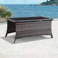 Table basse d'extérieur en rotin gris avec plateau en verre trempé